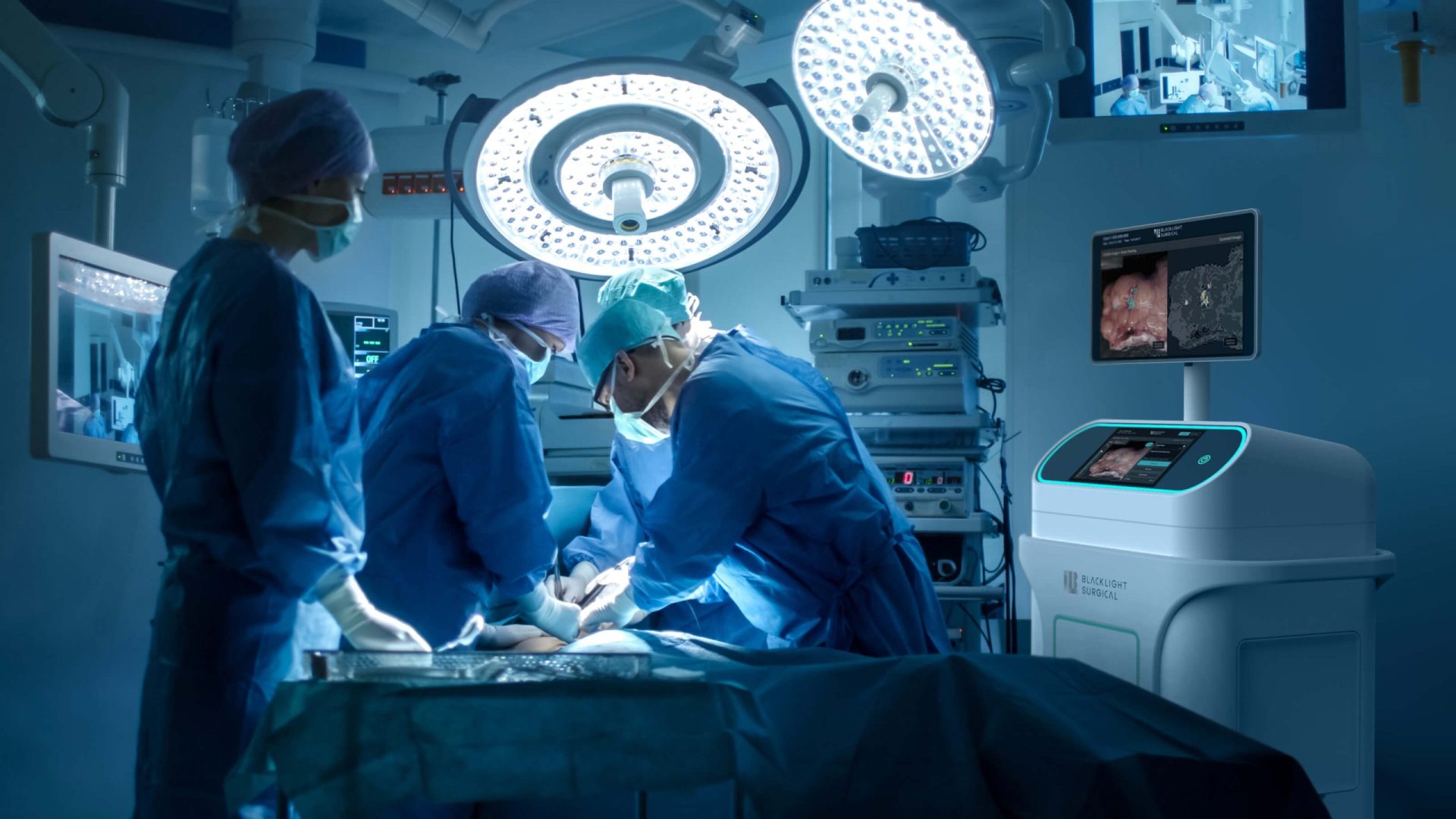 Medical team performing surgery in an operating room equipped with advanced technology.
