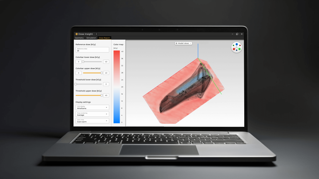 A laptop displaying Dose Insight's Design For Sterilization (DFS) software, a 3d model editing interface with a highlighted dose mapping on the shape.