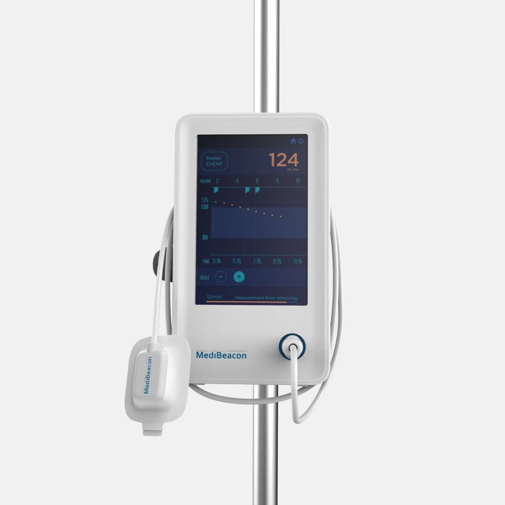 A product photograph of MediBeacon's white vital signs monitor and sensor attached to a stainless steel pole against a light gray background.