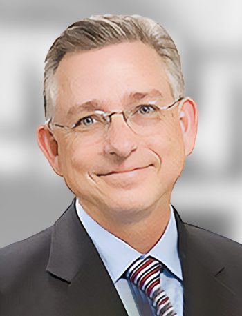 A portrait of a Scott Seaton, a smiling man with glasses wearing a suit and a striped tie.