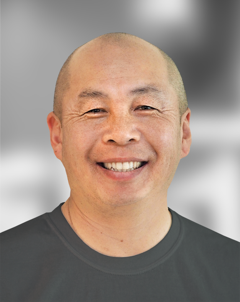 A portrait of Winston Sun, a smiling man with a gray background.