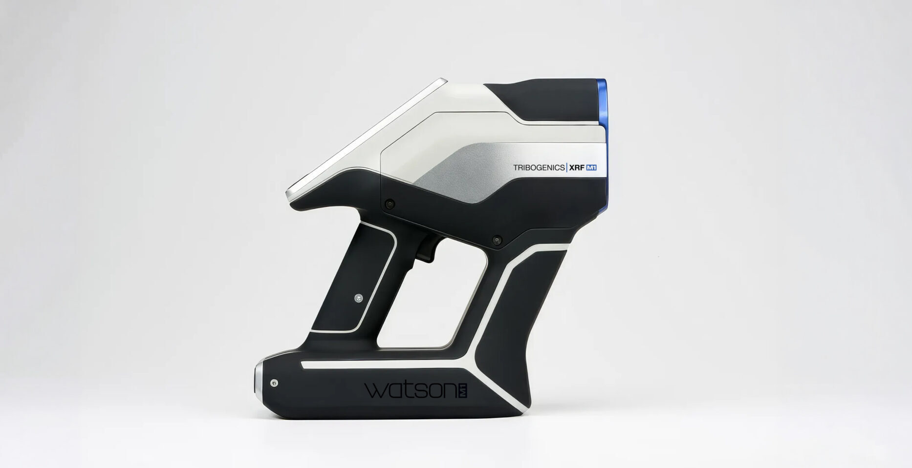 A handheld, black and silver device labeled "TRIBOGENICS XRF" and "watson," resembling a futuristic scanner, photographed against a plain white background.