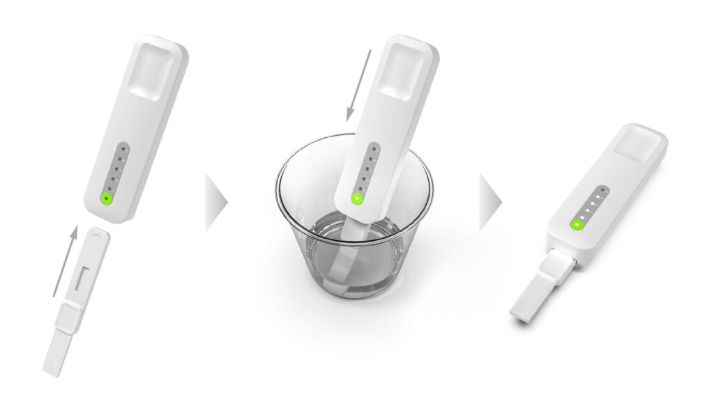 A white test device is dipped into a glass of water, then removed, showing a green light and indicator bars, illustrating a water testing process.
