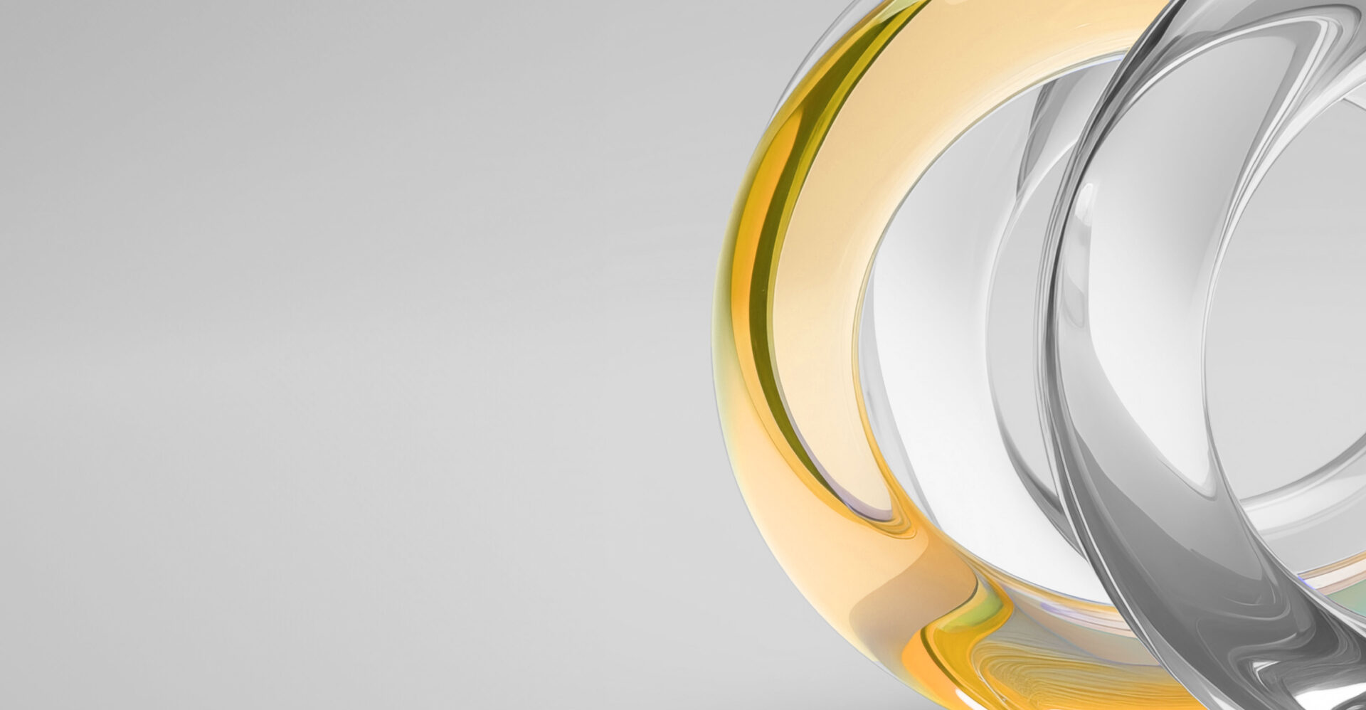Curved, glossy abstract shapes in gold and silver tones intersect on a plain light gray background, with minimal shadow and no text.